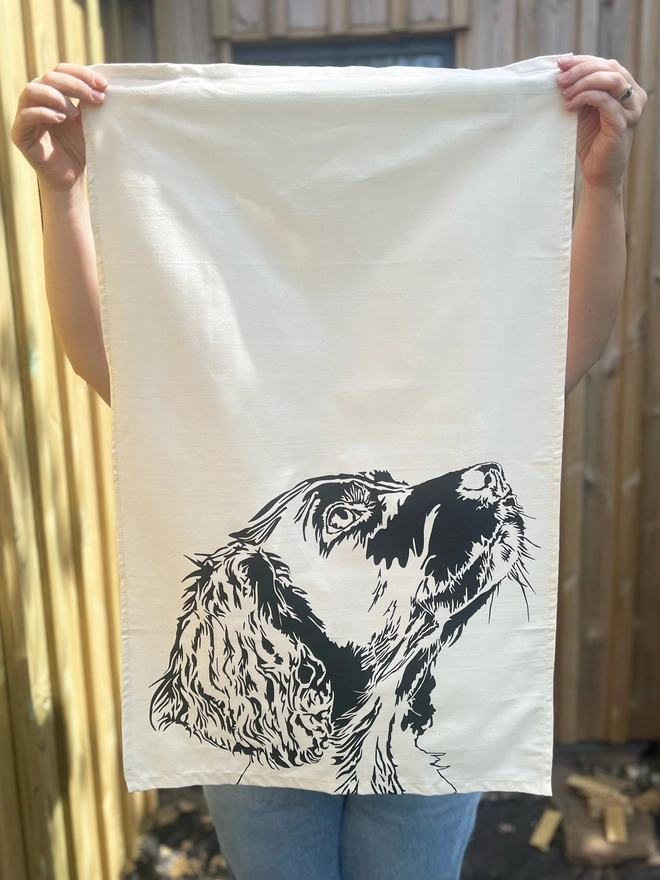 Springer dog tea towel illustrated with the side profile of a springers head