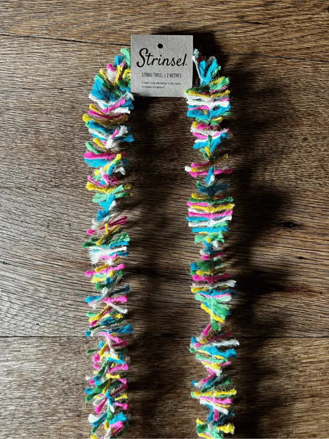 Neon Pop Strinsel AKA Jute string tinsel on an oak table