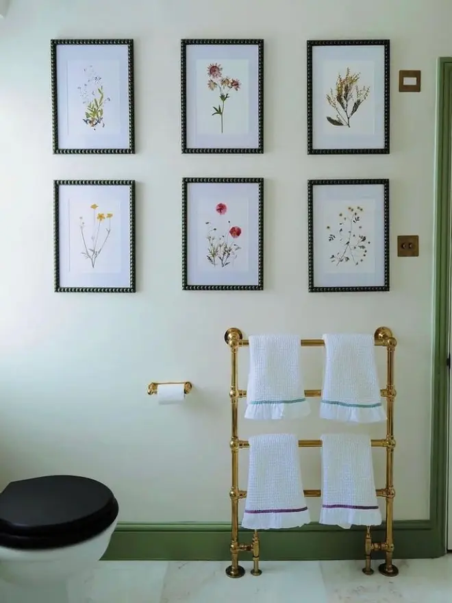Pressed Wildflower Herbarium Print Collection (Set Of 12), a collection of flowery prints sitting hung up on a wall. 