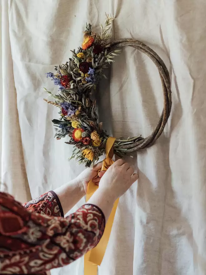 Autumn Wreath seen on a white wall