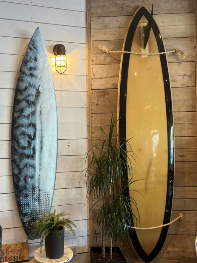 contemporary painting onto a surfboard