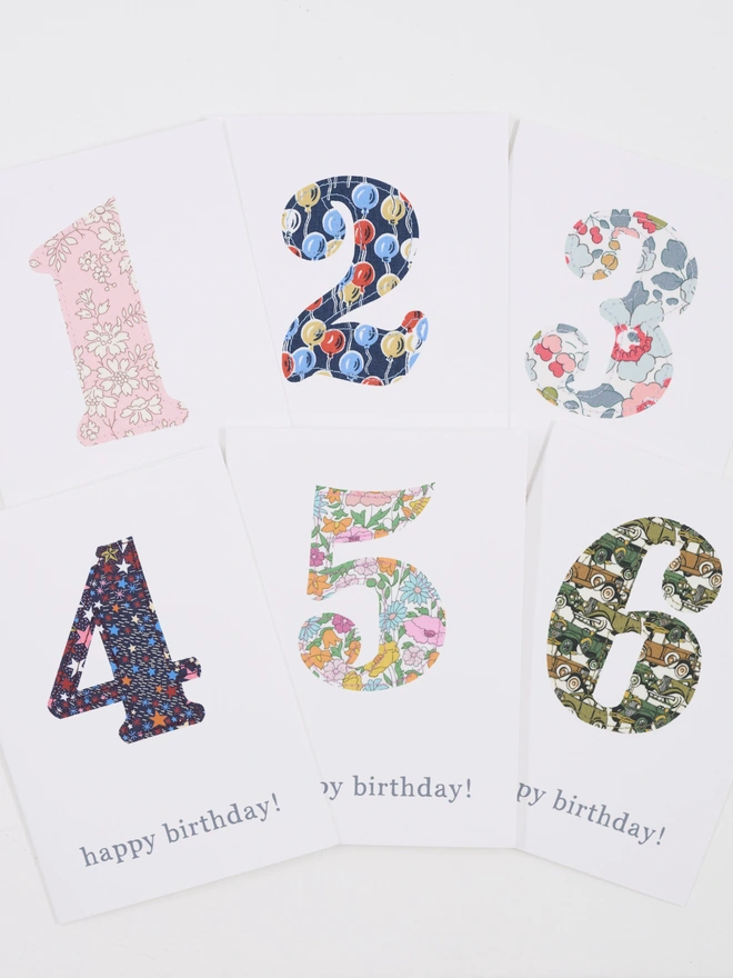 liberty print numbers sewn onto white greetings cards