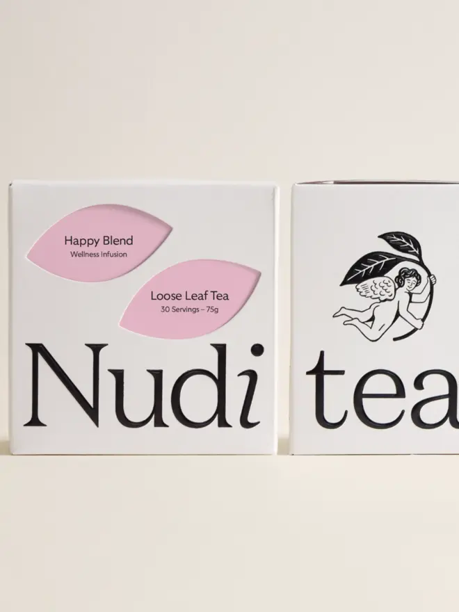 white box of happy blend tea with rose pink leaf designs