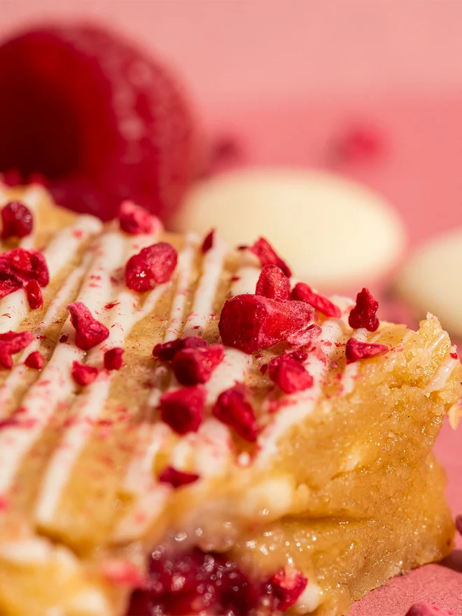 Valentine’s Brownie Selection (Box Of 6, 12, 16 Or 32), brownie sitting together on a pink surface. 