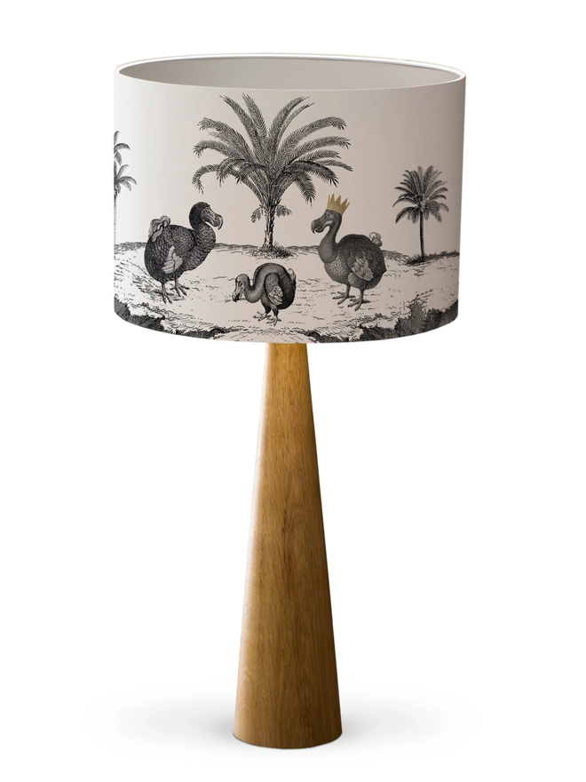 Drum Lampshade featuring Dodos with a white inner on a wooden base on a white background