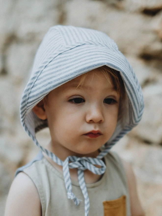 gorgeous baby boy in his sun hat