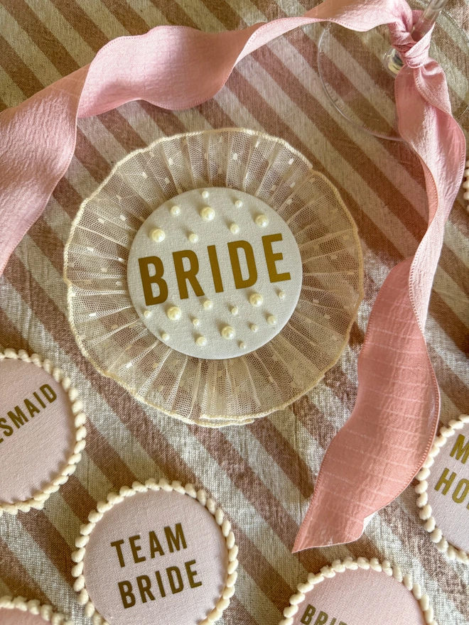 Cream/ Ivory Bride Badge with gold writing and a lace frill trim or pleated trim for hen party celebrations