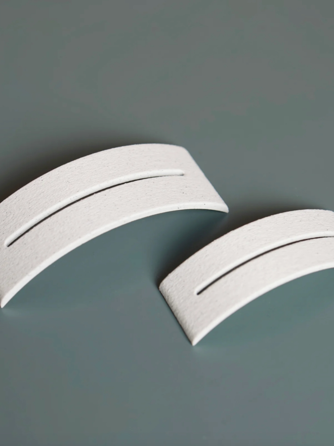 Hue Arch Place Card and Card Holder. The small and medium card holders are shown next to one another, highlighting their considerable difference in size.