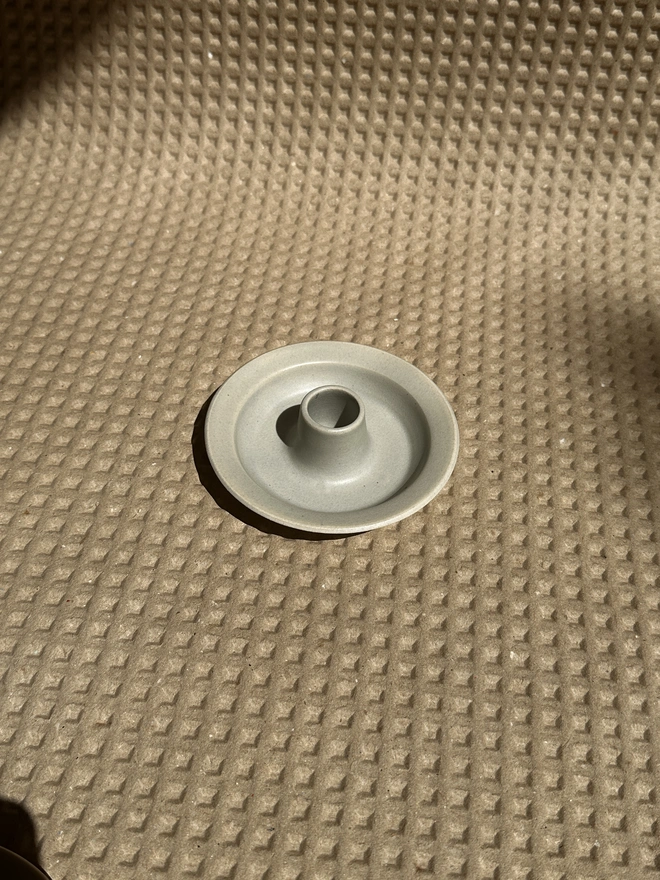 Pale blue flat candle holder