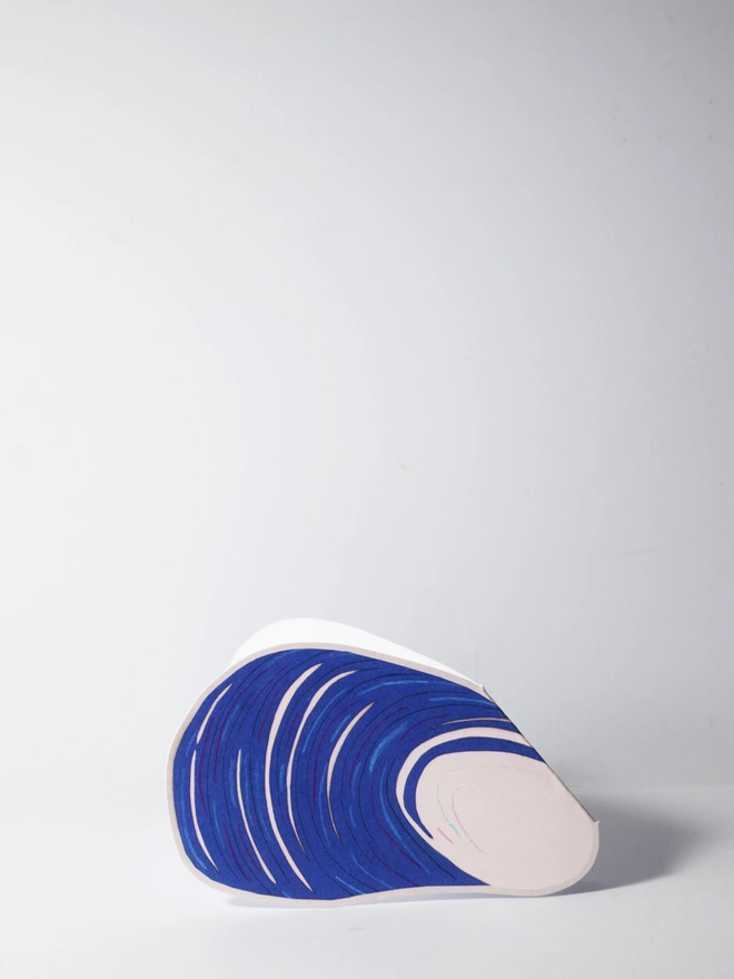 A cut out card of a mussel