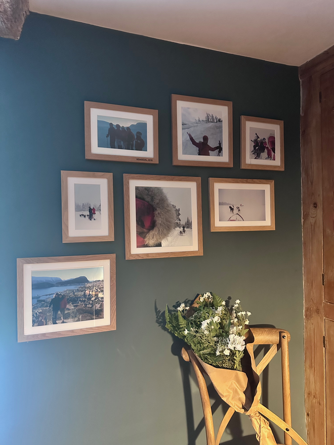 Collage of photos on blue wall