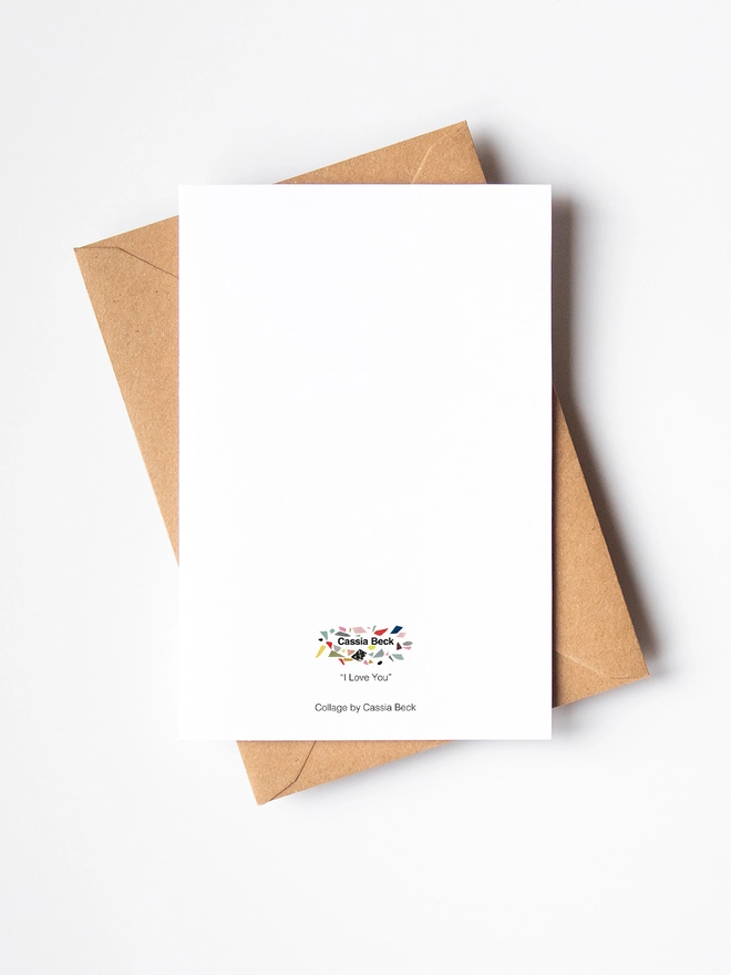 The reverse of a greeting card and a brown kraft envelope.