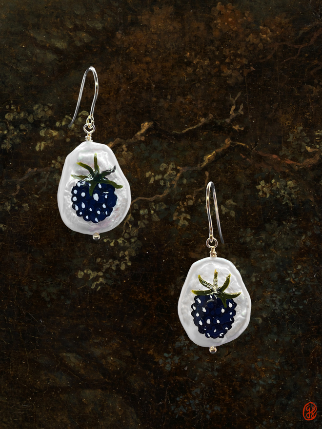 A pair of flat pear shaped pearl earrings each hand painted with a blackberry motif and set in 9ct gold.