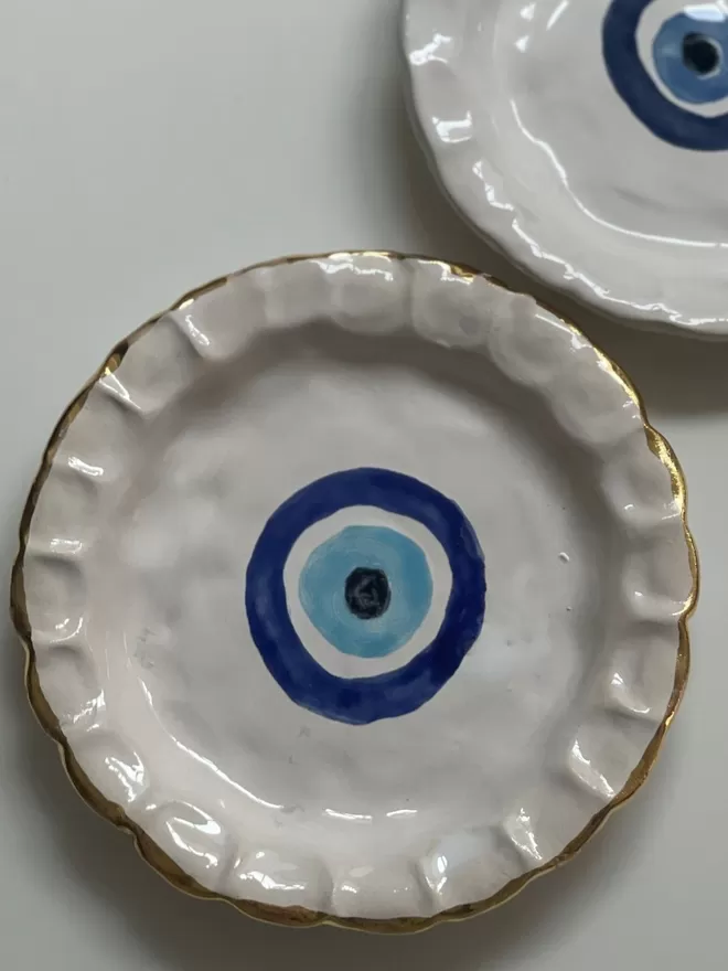 Evil Eye Chunky China Round Dinner Plate seen close up.