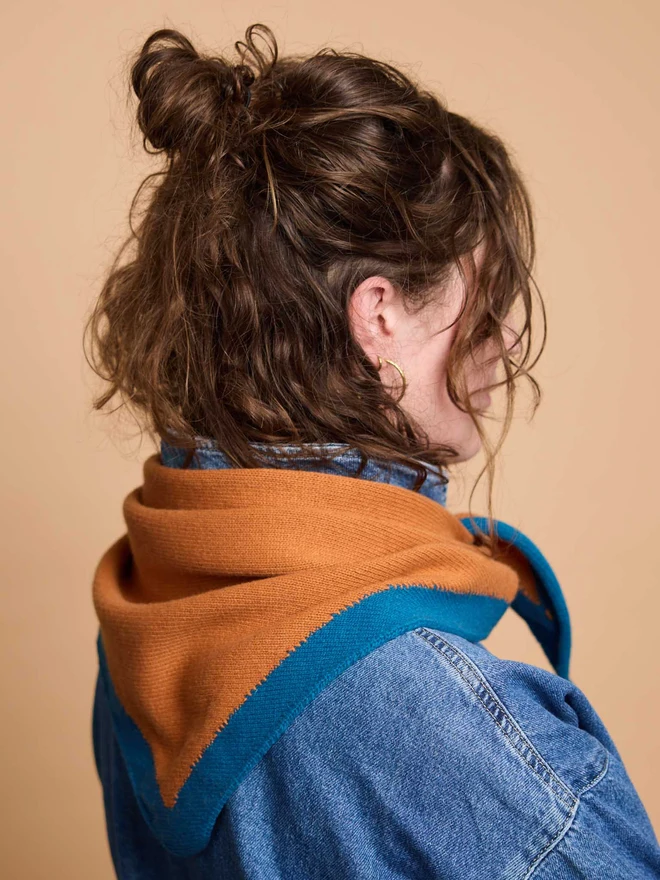 woman wearing rust wool neckerchief