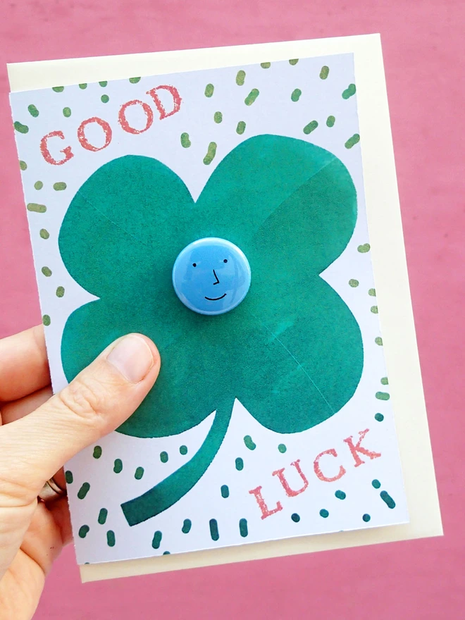 lucky clover good luck card with face pin badge