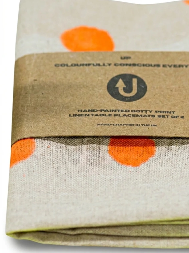 folded napkin with orange dots