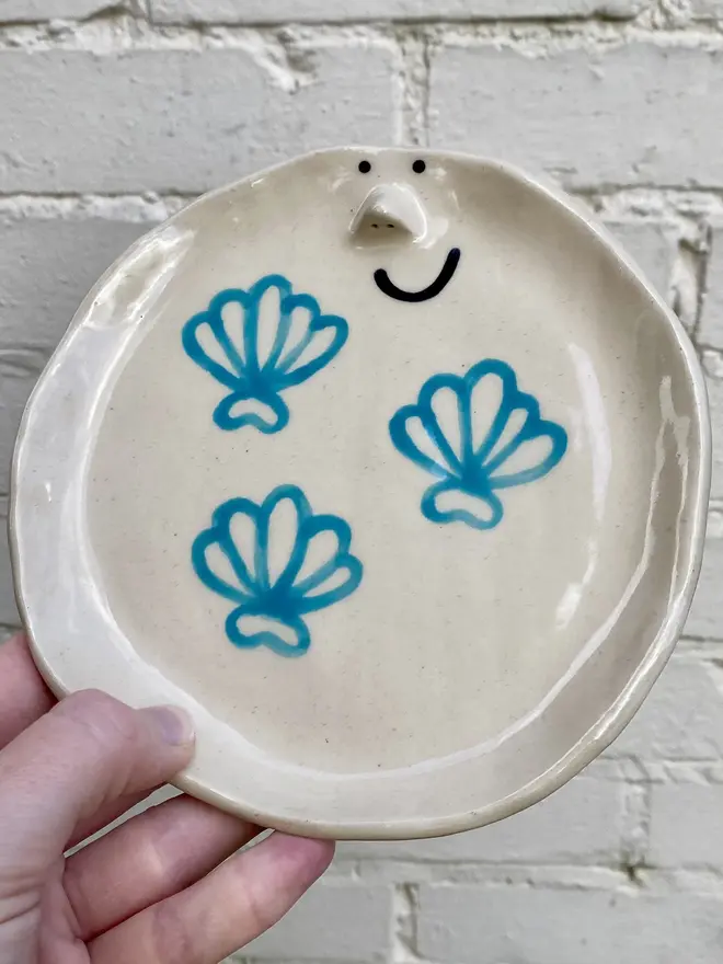 handmade ceramic shell smiley face plate