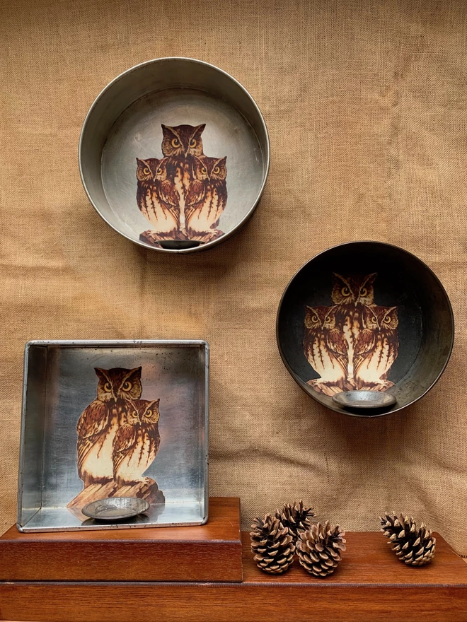 Three candle sconces with owls