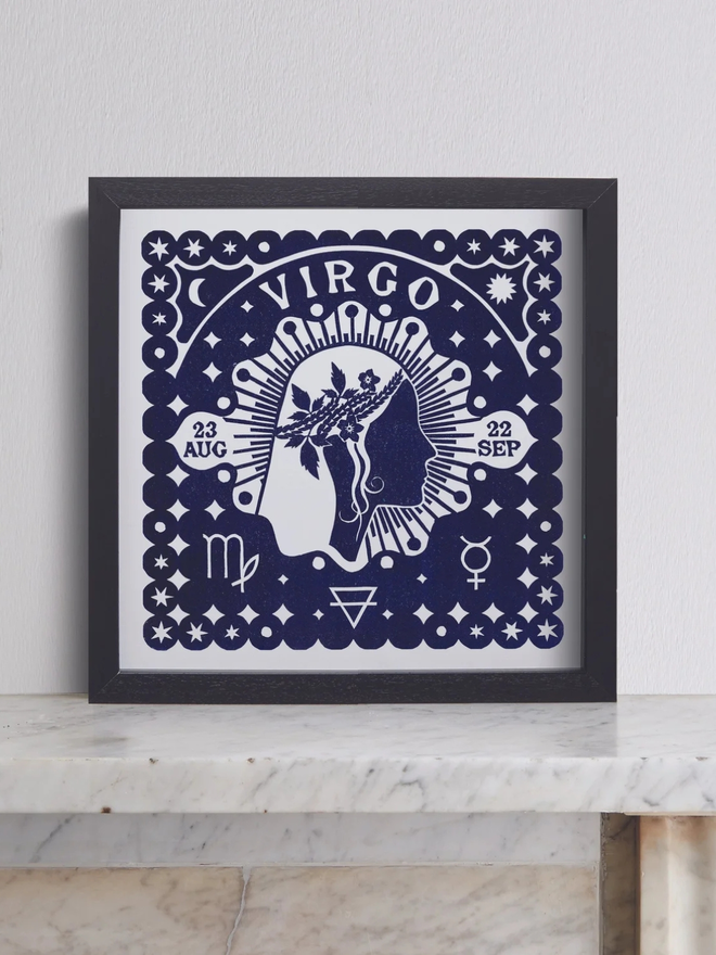 virgo zodiac linocut. a human side profile and zodiac symbols linocut on a blue background.