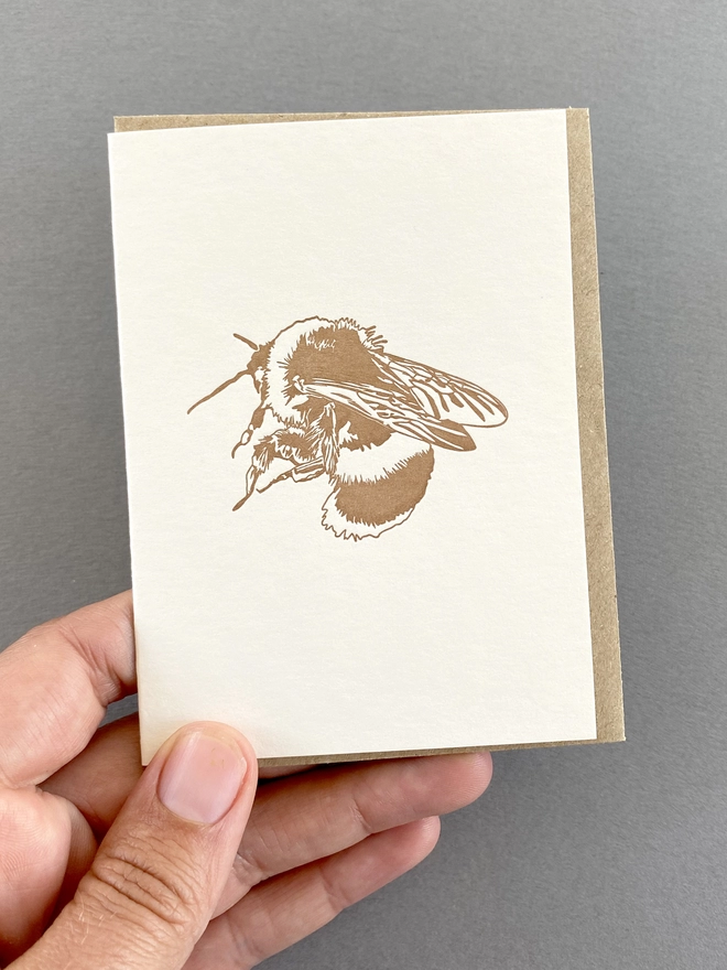 Metallic bronze/gold bee on small card with envelope