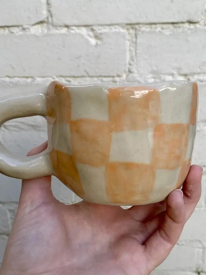 peachy checked handmade ceramic smiley face mug