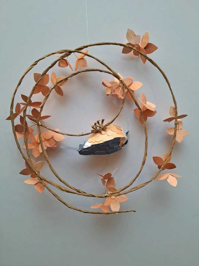 nuthatch bird sculpture on a peach hydrangea wreath back view
