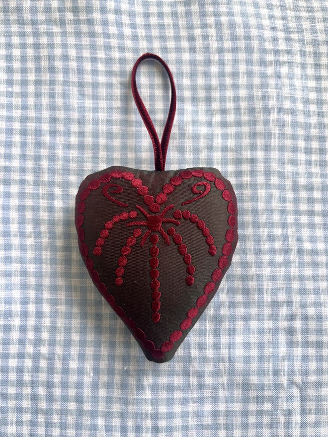 Silk heart ornament: Dark green silk, red thread and ribbon