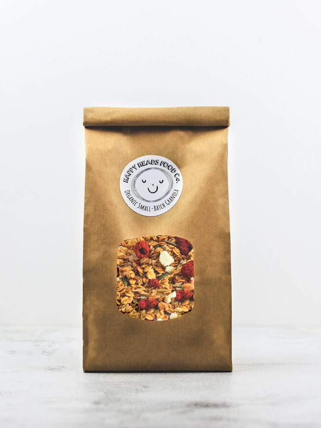 Happy Heads 'Raspberry & White Chocolate' granola in a medium (600 g) refill bag 
