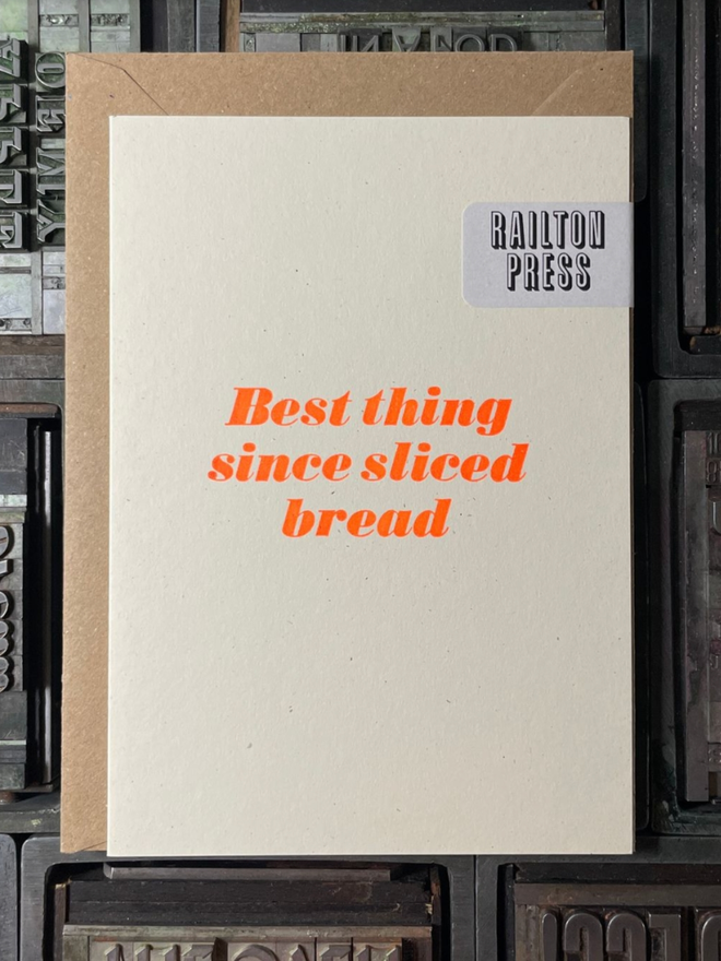 Best Thing Since Sliced Bread Card. A card with simple orange lettering.
