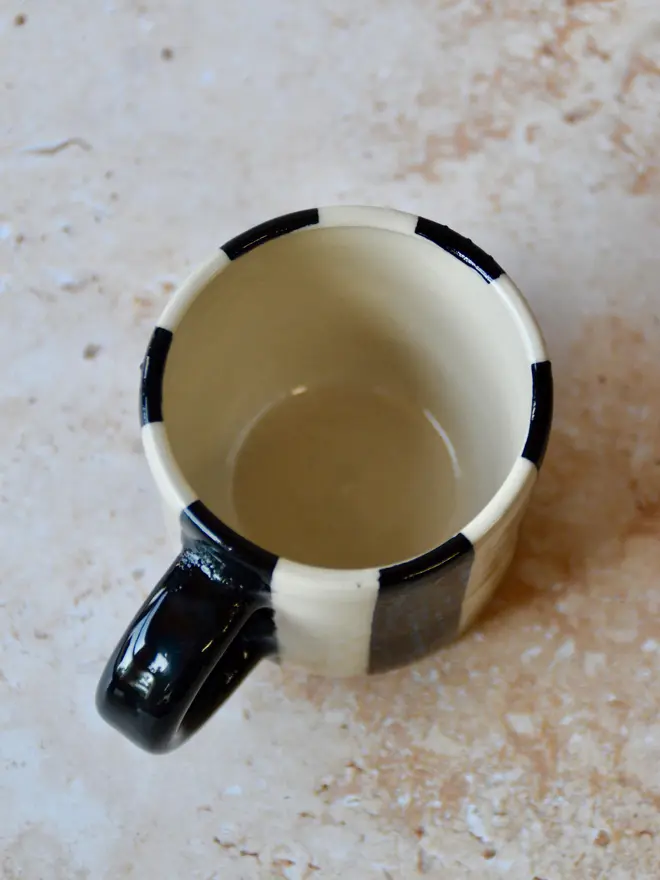 Le Petit Rayé handmade espresso cup top view showing glaze - black and cream stripe