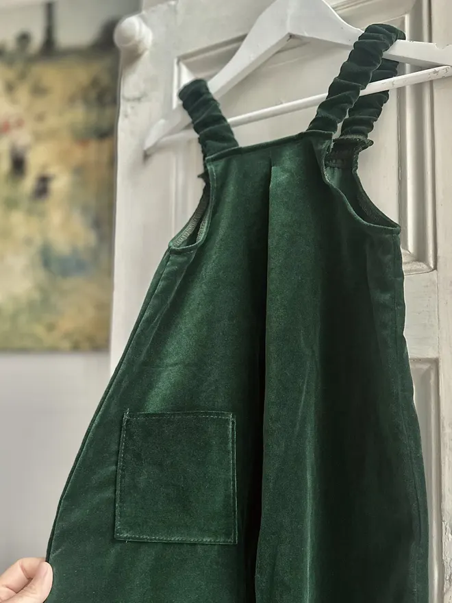 back of kids velvet dungarees deep green featuring pocket