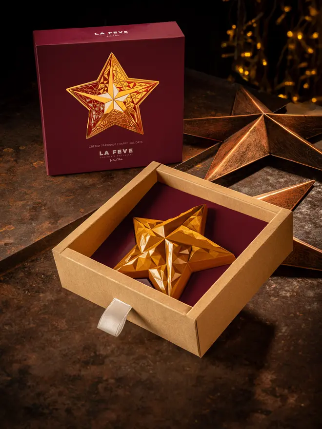 Golden christmas star chocolate with red eco-lux packaging