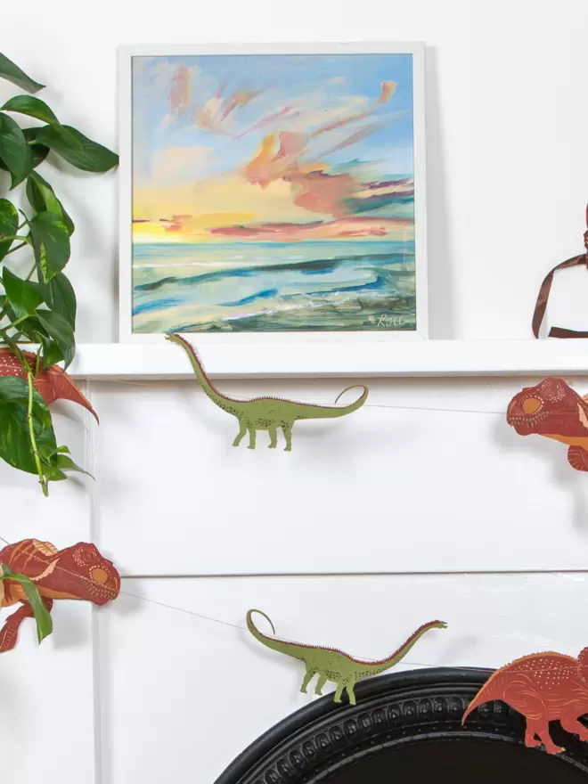 Dinosaur garland shapes with beach themed canvas