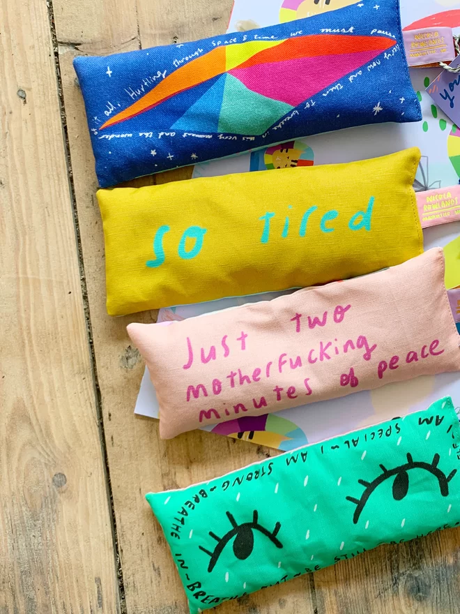 Four different designs of lavender eye pillows by Nicola Rowlands in bright colourful designs. 