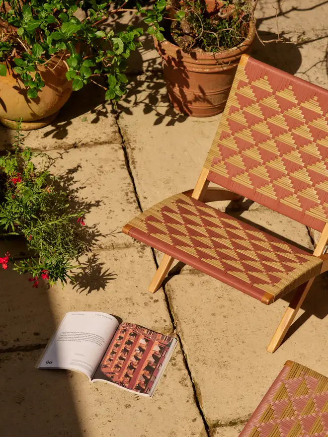 Burnt ochre lounge chair with book