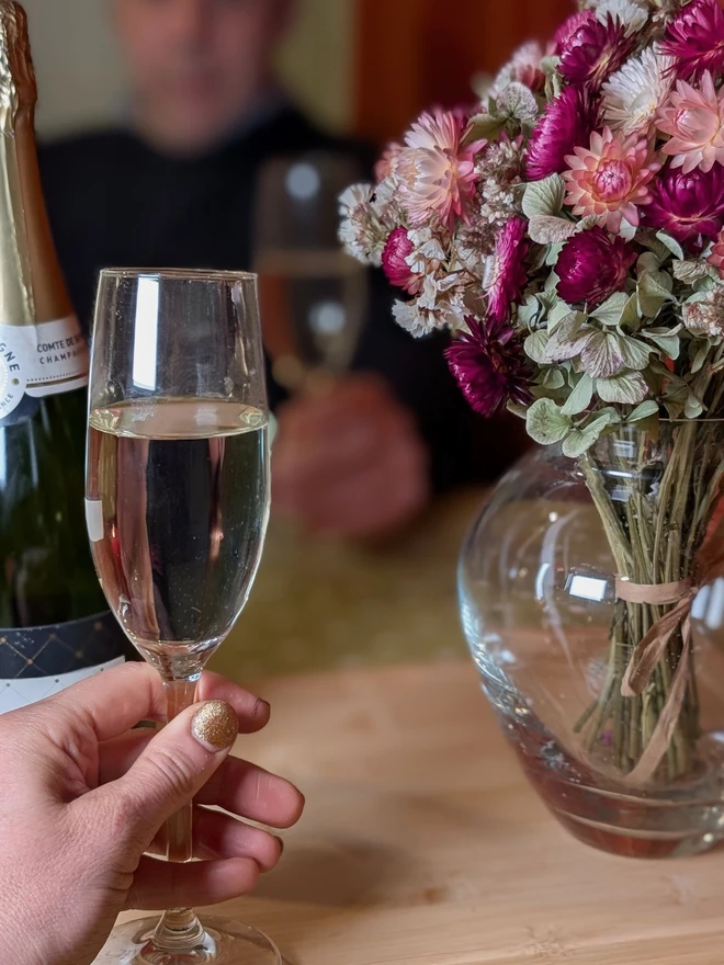 Pink flowers with with champagne celebration 