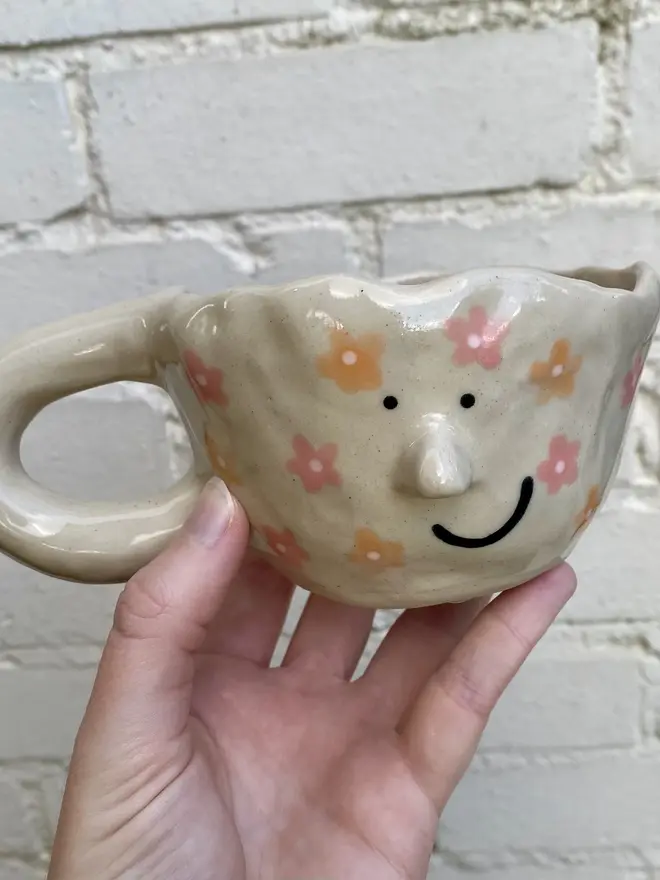 pink orange floral handmade ceramic smiley face mug