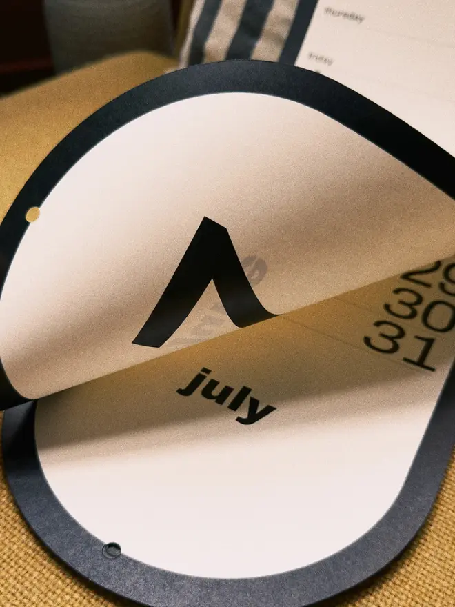 Obok 2027 Arched Wall Calendar detail showing large month number and name, and the double arched sides.