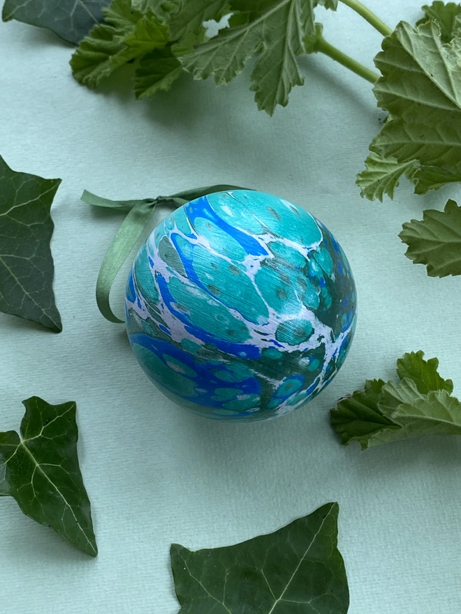 A large hand-marbled ceramic bauble