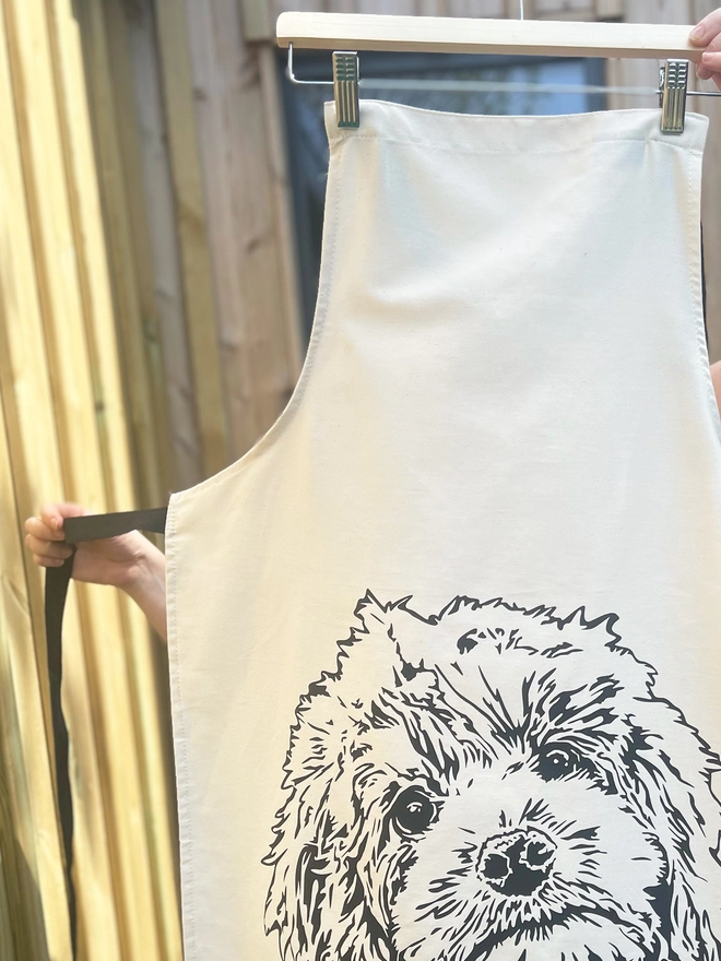 Close up of the cockapoo apron, showing the contrasting black ties