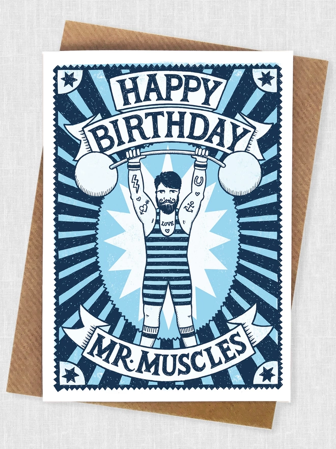 blue muscle man birthday card with kraft brown envelope
