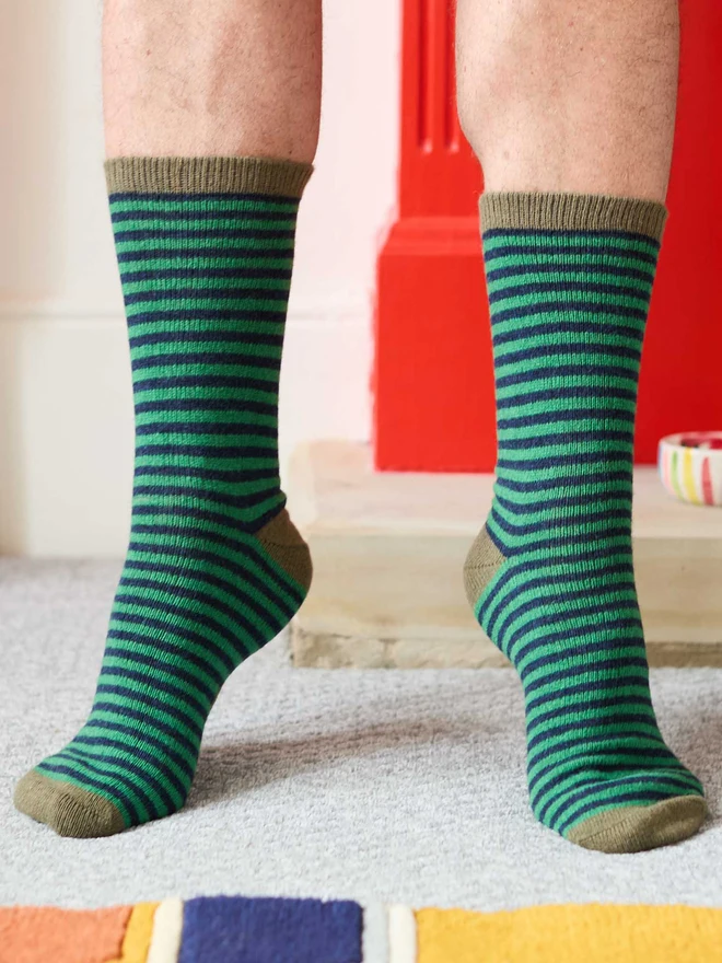 mean wearing green and navy blue striped socks