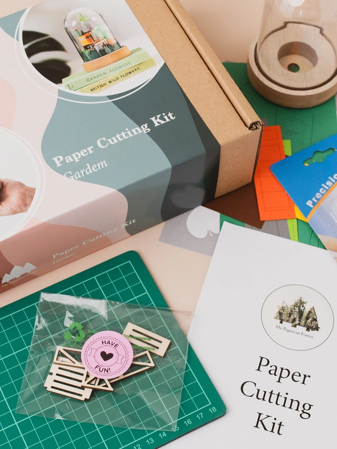 a box and packaging of my papercut forest garden craft kit