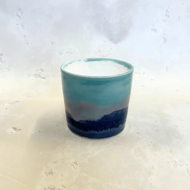 Landscape Medium Pot, a colourful pot on a stone surface.