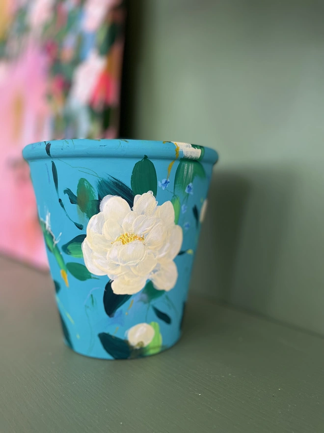 Hand painted floral plant pot, turquoise background with pale yellow peonies 