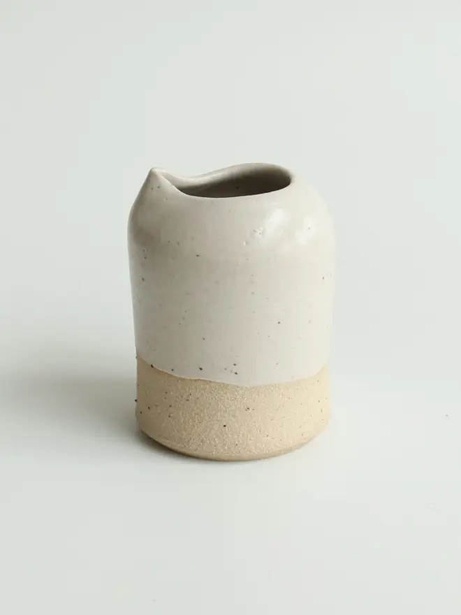 Off-white ceramic milk jug