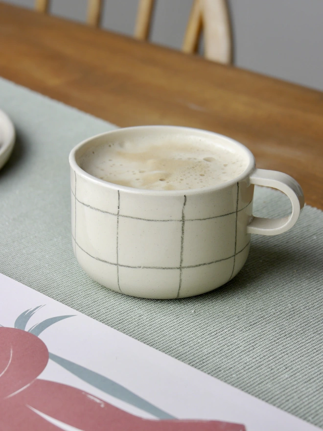 Small handmade grid pattern mug