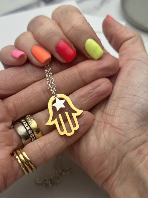 gold hamsa hand charm with silver mini star