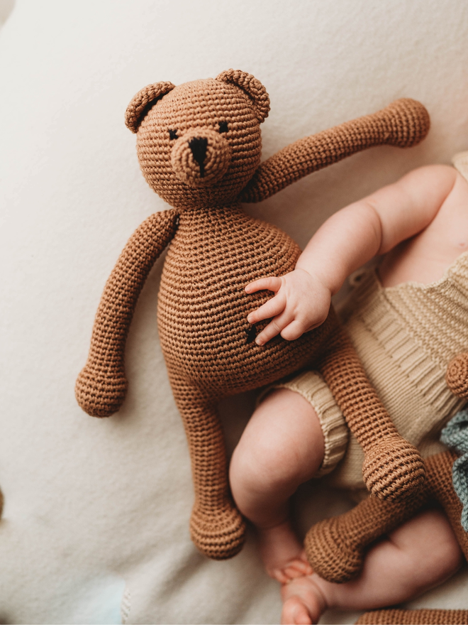 handmade brown crochet teddy bear lifestyle shot